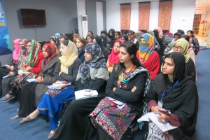 Women listen intently during a GRE orientation session at Islamic International University, Islamabad.