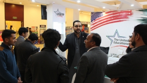 Potential students listening to Umair Khan regarding opportunities to study in the U.S.
