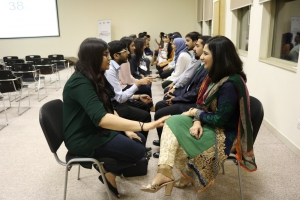 Alumni perfecting their elevator pitches during the speed networking round at Fulbright Connect in Lahore.