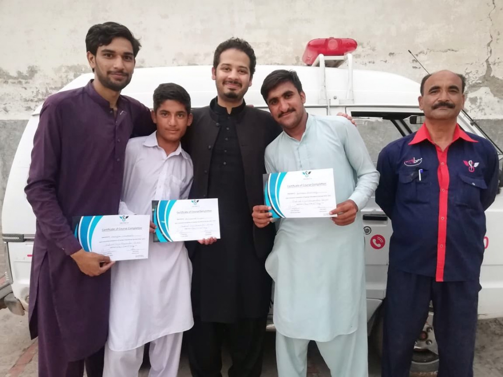 Usama with trainee's from Saving 9 Pind Begwal’s Basic Health Unit 