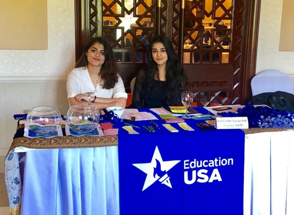 EdUSA's summer interns Amna and Alezeh assisting the staff at an event.