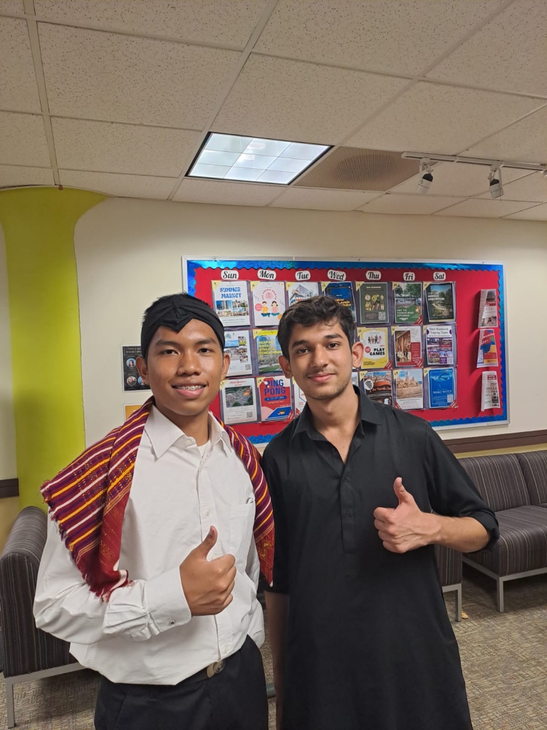 In traditional clothing with a fellow Indonesian on the cultural day