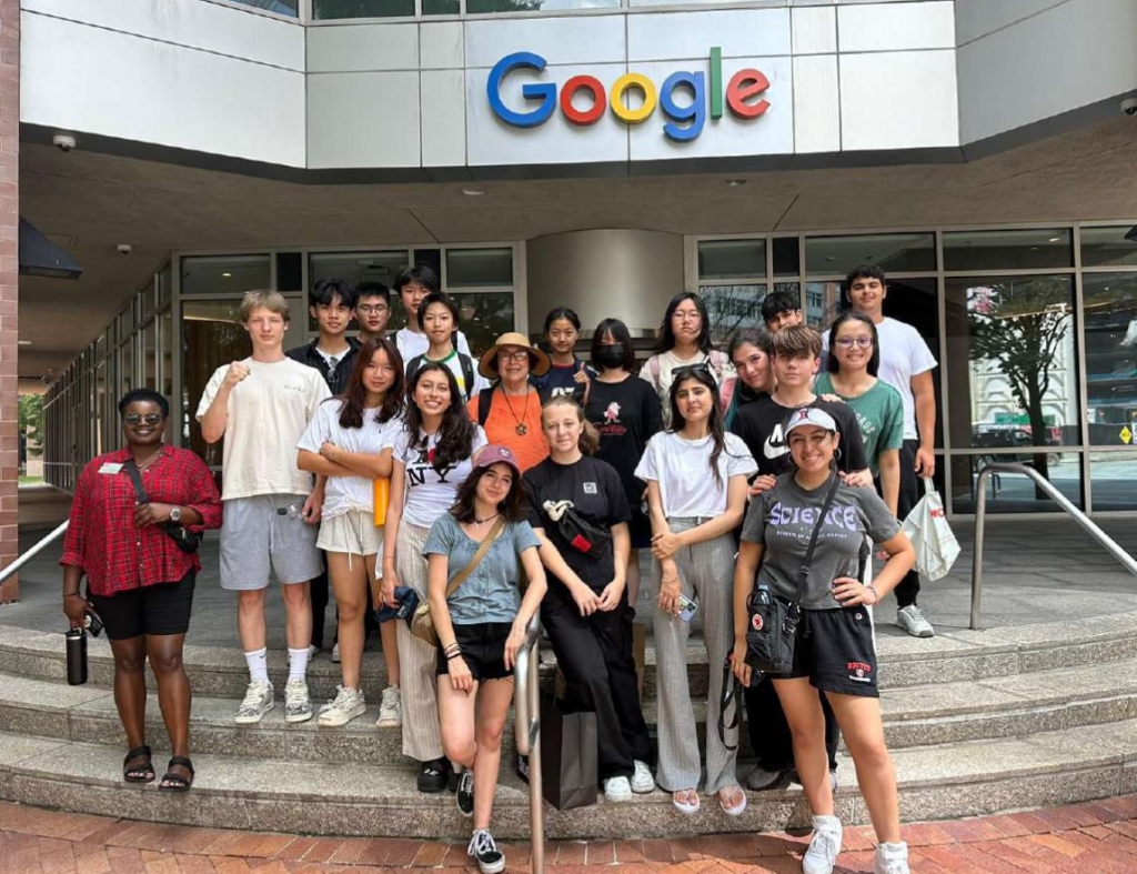 Ahmad and Shoukat tour the Google office in Boston with their cohort.