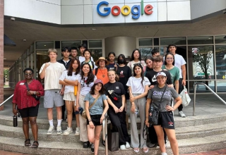 Ahmad and Shoukat tour the Google office in Boston with their cohort.