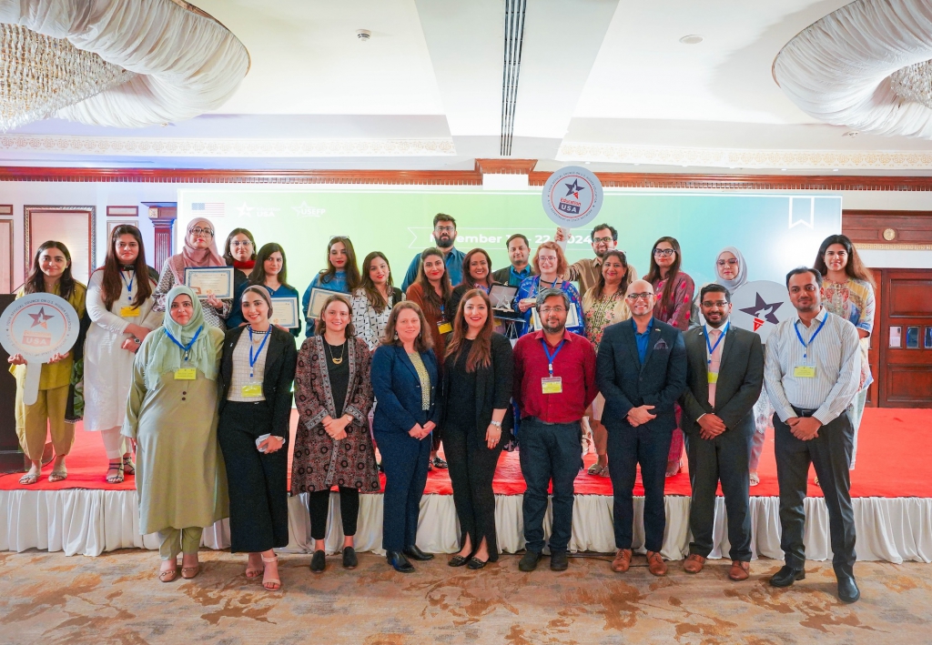 Counselors pose for a picture with Team Education and representatives from the U.S. consulate in Karachi