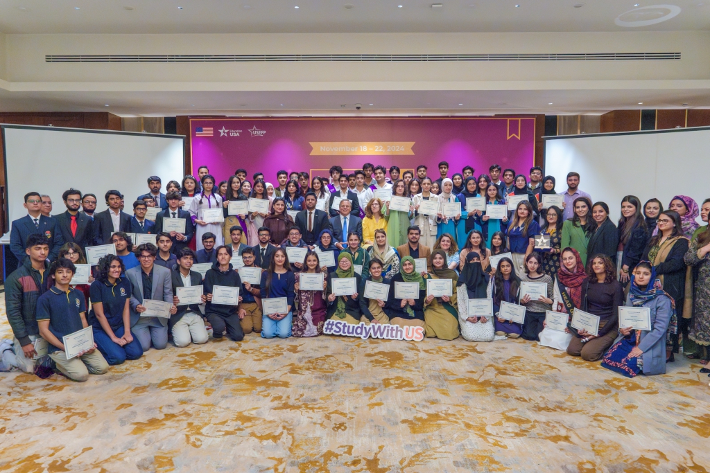 A group photo of students and counselors with the Ambassador and EdUSA staff in Islamabad