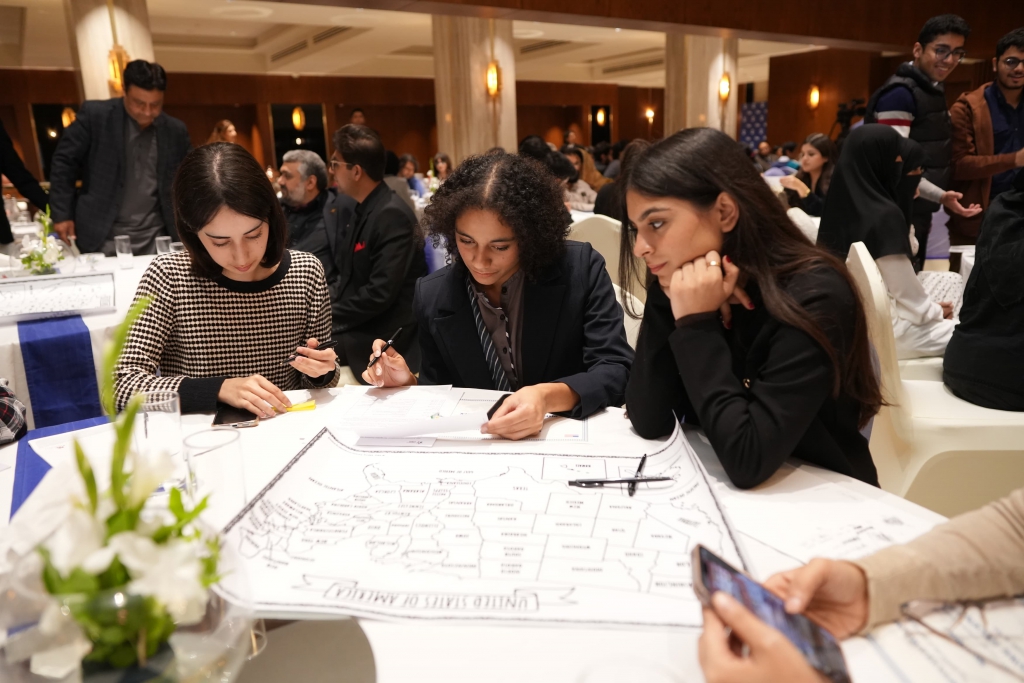 Students working on the map activity in Islamabad