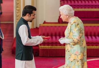 Hassan Mujtaba Zaidi receiving the prestigious Queen's Young Leaders Award from Queen Elizabeth II