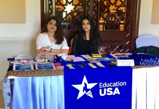 EdUSA's summer interns Amna and Alezeh assisting the staff at an event.